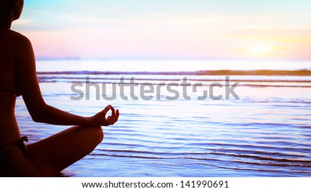 yoga, silhouette of meditating woman