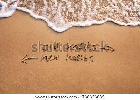 old habits vs new habits, life change concept written on sand Foto stock © 