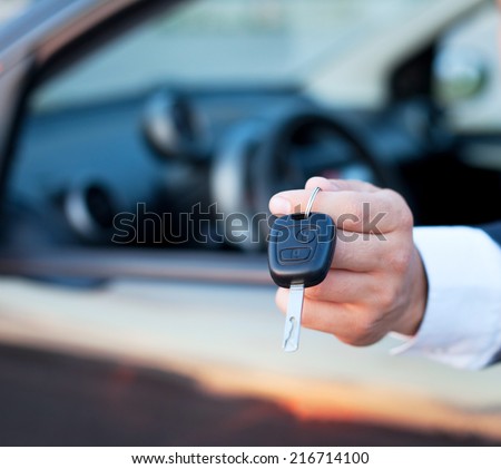 car keys in the hand, rent or buy car