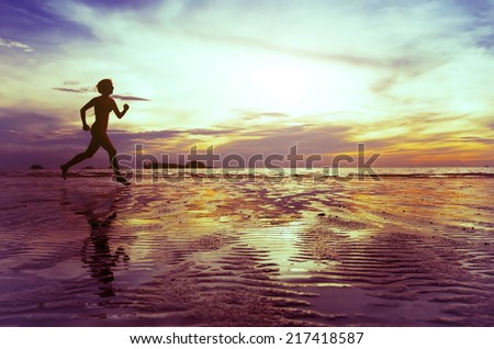 goal, silhouette of barefoot woman running on the beach