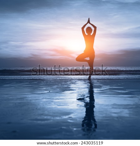 wellness concept, beautiful silhouette of woman practicing yoga