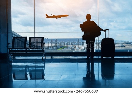 Similar – Foto Bild Frau am Flughafen, die auf die Fluginformationstafel schaut.