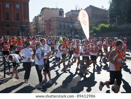 ROME, ITALY-OCTOBER 16: Unidentified runners in the sixth edition the race Run for Food on October 16,2011 in Rome, Italy. Approximately 1298 athletes participated in the race to fight world hunger.