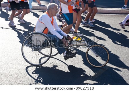 ROME,ITALY-OCTOBER 16:unidentified athlete in an adapted vehicle in  sixth edition disabled the Run for Food race on October 16,2011 in Rome,Italy.Approximately 1298 athletes participate in the race