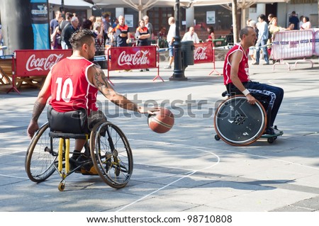 TOLEDO, SPAIN-OCTOBER 1: Some unidentified people playing a friendly game of wheelchair basketball, one of the activities in the Youth Week on October 1, 2011 in Toledo, Spain