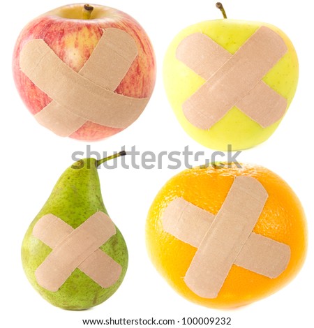 A picture of two apples, a pear, and a orange with bandages..Sick fruit..