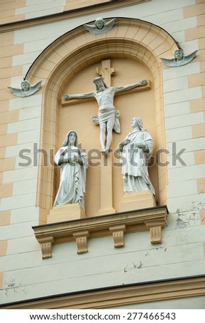 Dubranec, Croatia - May 2, 2015: The Church of Saint Mary of Snow. Statue of Jesus Crucified with Mary and John standing next to him.