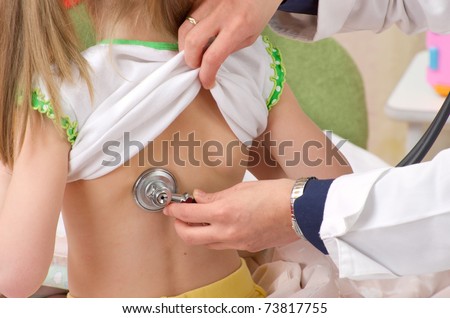 doctor listening to heartbeat of 4 years old girl at home