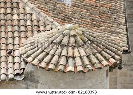 Detail of eaves and rooftop with roofing tiles.