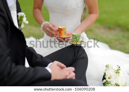 Special wedding toast with cups, focused to green cup