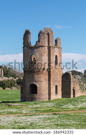 Ruins of the Circus of Maxentius lie in the spring sun along the ancient Appian Way in Rome, Italy.