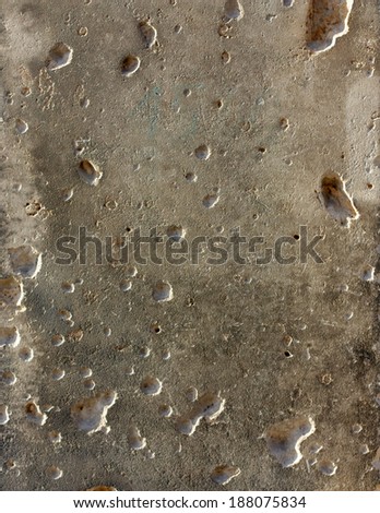 Once smooth surface of limestone on a museum in Berlin, Germany, once and forever bearing the scars of the countless bullets that struck it in the last days of the second world war.
