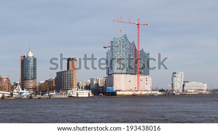 HAMBURG, GERMANY - MARCH 20, 2014: Construction of the landmark Elbe Philharmonic building rises in Hamburg, Germany on March 20, 2014.