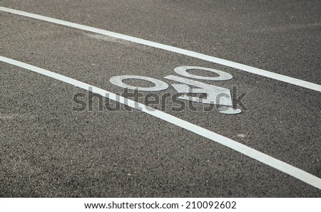 Close-up of bike lane in the summer afternoon sun.