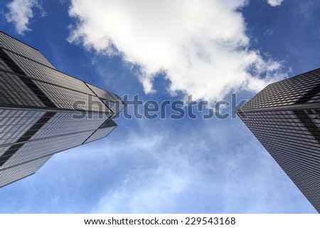 CHICAGO, IL, USA - OCTOBER 11, 2014: View straight up at blue skies between Willis Tower and a neighboring skyscraper in Chicago, IL, USA on October 11, 2014..
