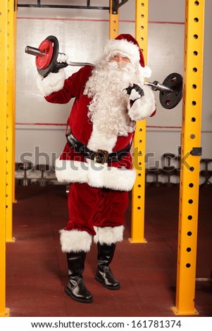 Santa Claus physical condition training before Christmas time in gym