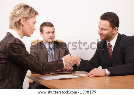 deal - Group of  3 business people - man and woman hand shake
