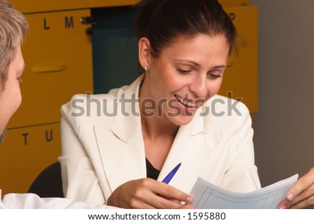 Happy,smiling secretary, talking to a man - close up