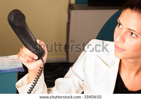 Medical secretary handing a phone to the doctor  - close up