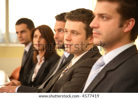 five business people at the meeting - debate