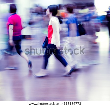 city people crowd in a station of the metro abstract background blur action