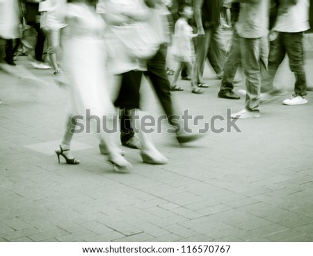 abstract image of business people rushing on the street blurred motion?black and white
