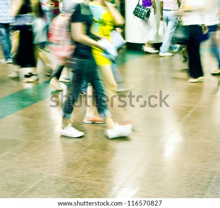 city people rushing in a station of the metro abstract background blur action