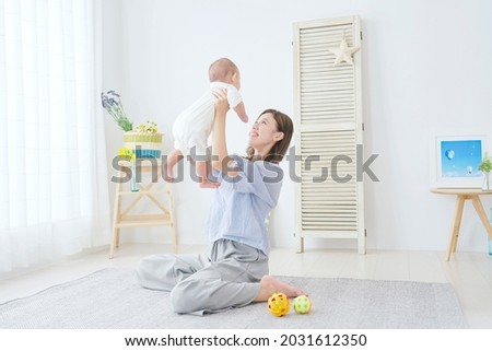 Similar – Image, Stock Photo young mother playing with baby girl outdoors in a park, happy family concept. love mother daughter