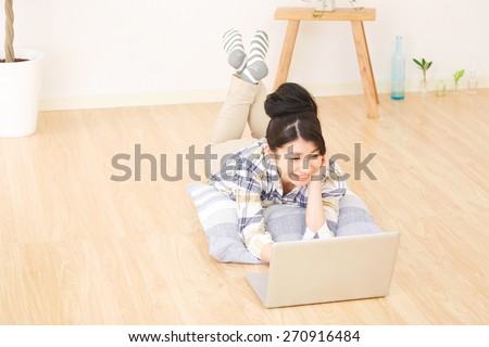 smiling Japanese woman with PC