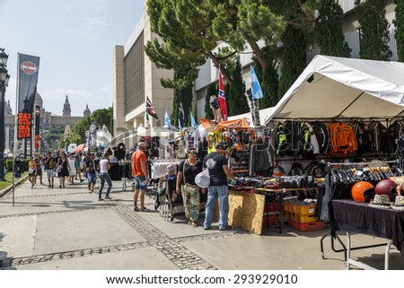 BARCELONA, SPAIN - JULY 04, 2015: Unidentified persons with a Harley Davidson motorbike at an exhibition during BARCELONA HARLEY DAYS 2015, The event brought together over 12,000 motorcycles.