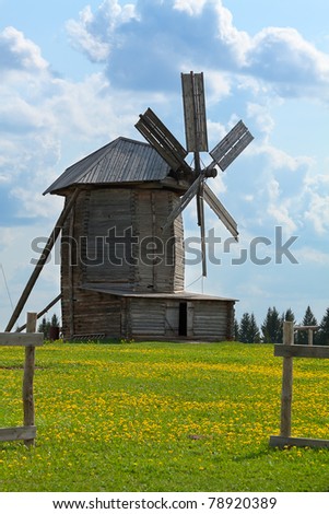 Windmill on background blue sky at dandelion