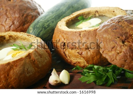 Traditional Polish soup made from fermented rye, served in bread .