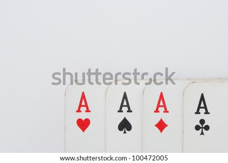 ace of four playing cards playing cards on white background complete view on the right below