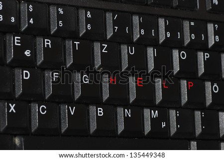 help diagonally in red writing on a computer keyboard