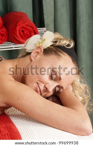 Portrait of a woman relaxing in the massage / Face of a woman relaxing
