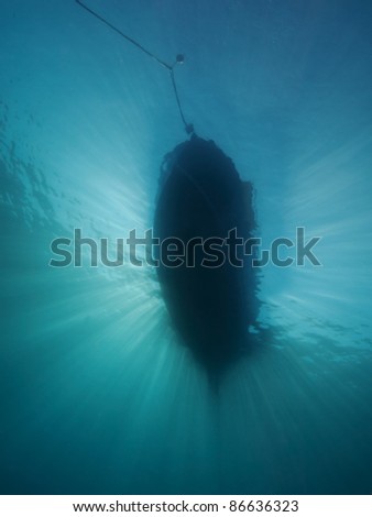 Back light underwater (Wide angle photography below a dive boat)