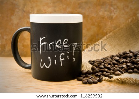 free wifi, coffee mug with coffee beans & hessian on counter