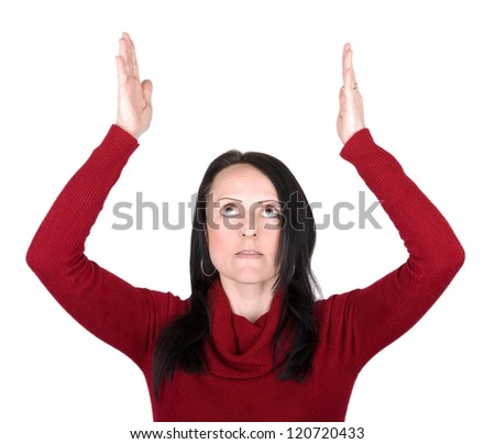woman pretending to hold something above her head against a white background