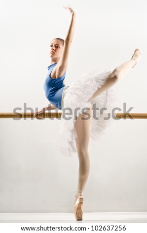 classic ballet dancer in white tutu posing
