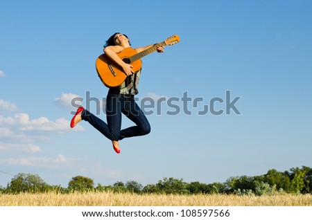 Female guitarist in the jump.