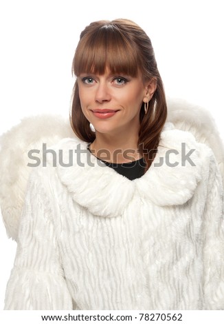 portrait of a woman brunette in a white coat and wings on the isolated background. Symbolizes an angel.