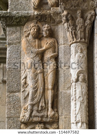 Romanesque Adam and Eve in Platerias facade in Saint James Compostela Cathedral