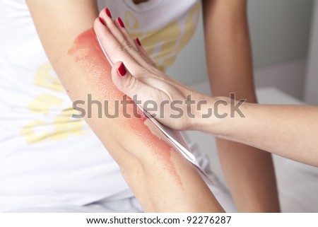 Female arm waxing