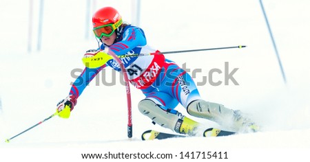 POZZA DI FASSA, ITALY - DECEMBER 30: Unidentified participant of ski race performs at Italian Slalom Championship on December 30, 2012, Pozza di Fassa, Italy
