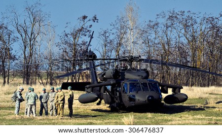 GALATI, ROMANIA - MARCH 24: BLACK HAWK fighting helicopter in Romanian military polygon in the exercise Smardan Saber Junction 15 on Galati, Romania, 24 march 2014.