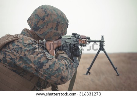 GALATI, ROMANIA - OCTOBER 8: US Marines with semiautomatic rifle on the firing line in Romanian military polygon in the exercise Smardan Danube Express 14 on Galati, Romania, 8 october 2014.