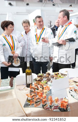BUCHAREST, ROMANIA - OCTOBER 29: Unidentified chefs and wine tasters get together to pick winners at National Wine Show of Romania at Romaero Baneasa on October 29, 2011, Bucharest, Romania
