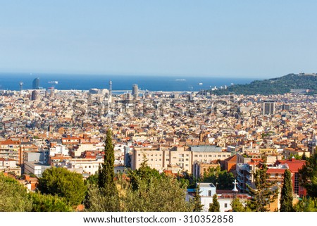 Panoramic aerial view of Barcelona with the sea and blue sky on a background