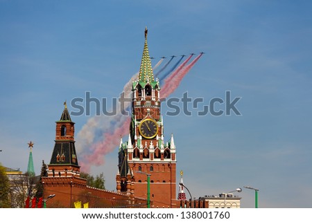 MOSCOW-MAY 9:Jets with colored smoke fly overhead during the annual Victory Day parade on May 9,2013 in Moscow. Moscow parade is held to commemorate the 68th anniversary of the capitulation of Nazi.