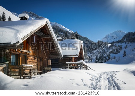 wonderful winter scenery with snow and timber cabin chalet home